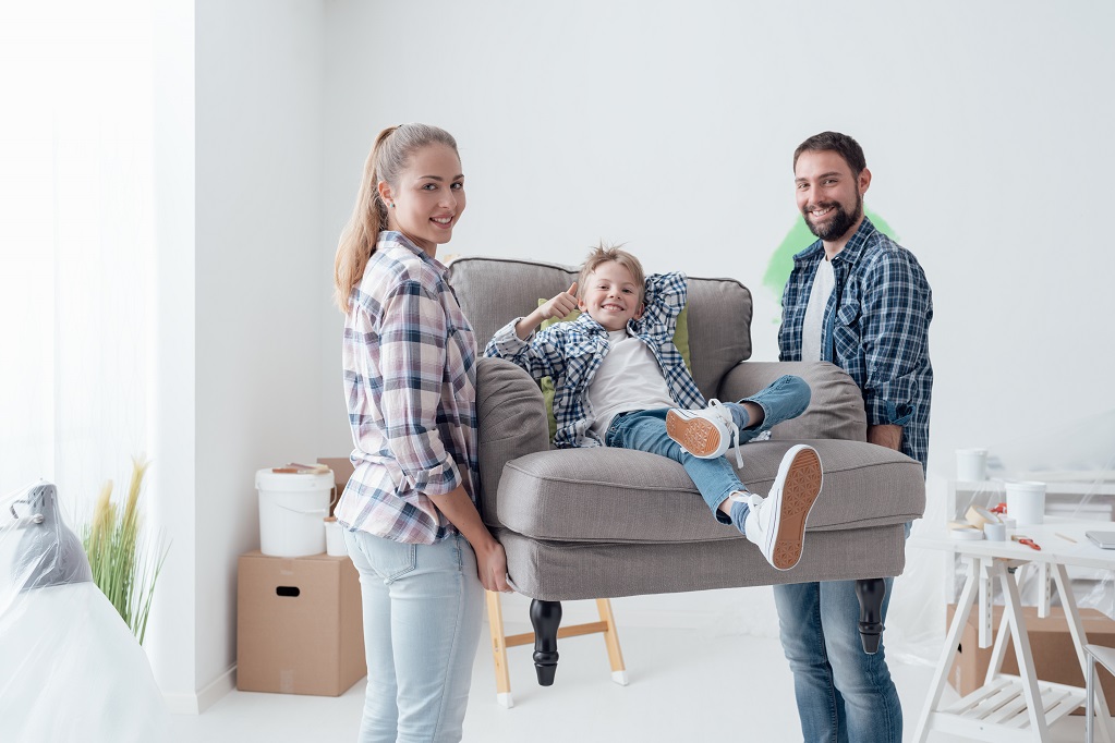 Family moving into a new home Young family moving into new home